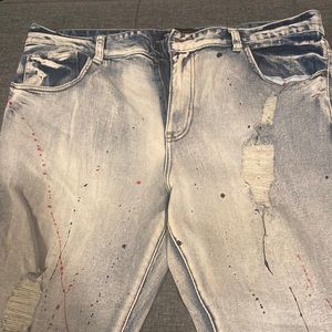 Gently worn “painted” jeans size 40 with 32 inseam.